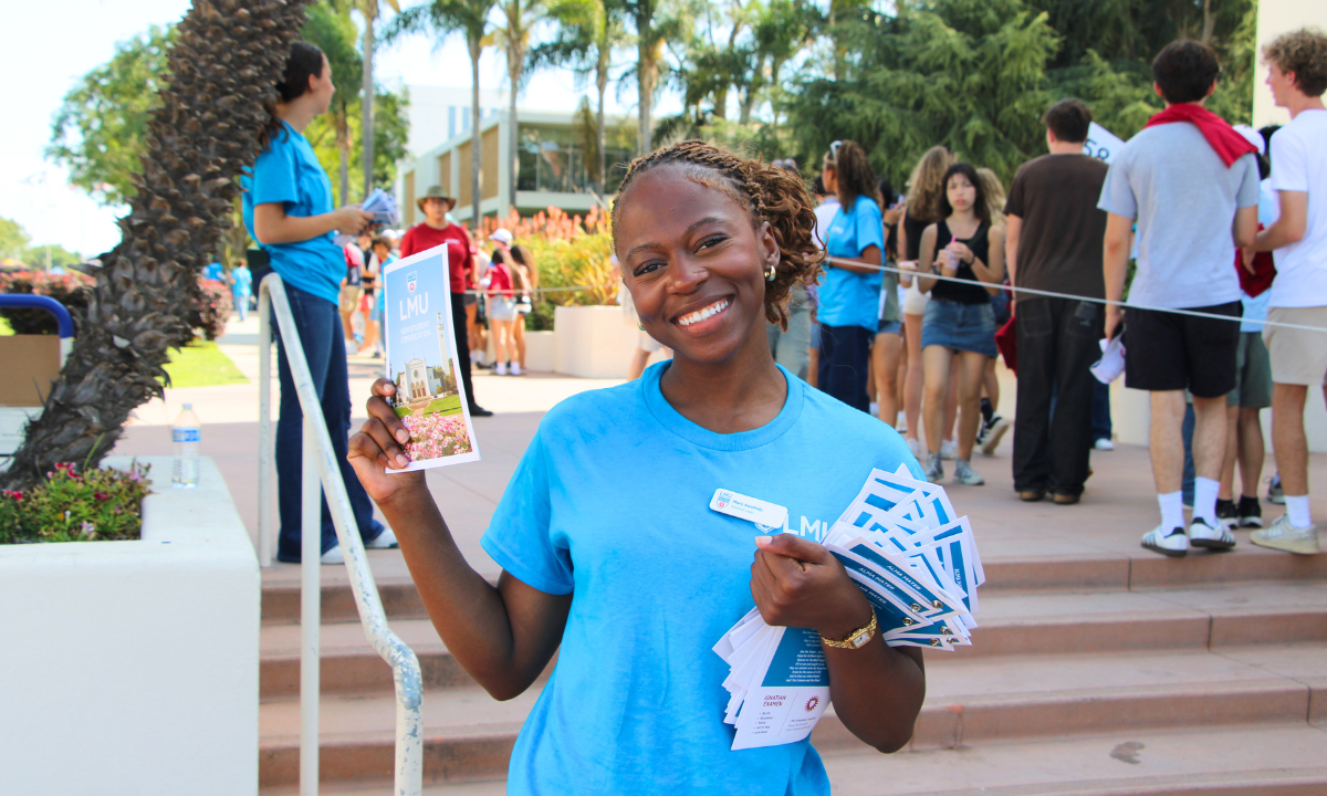 Student holding convocation program