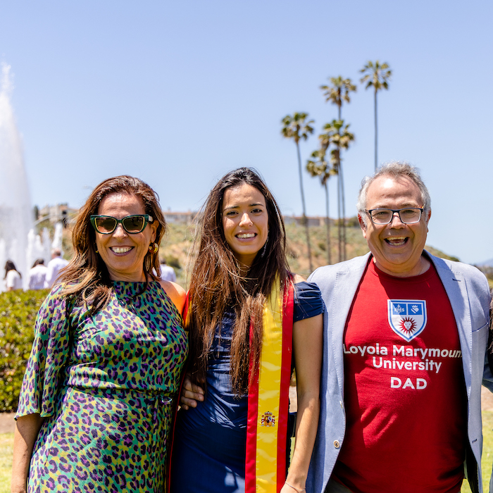 Parents of international student posing together at a celebration brunch